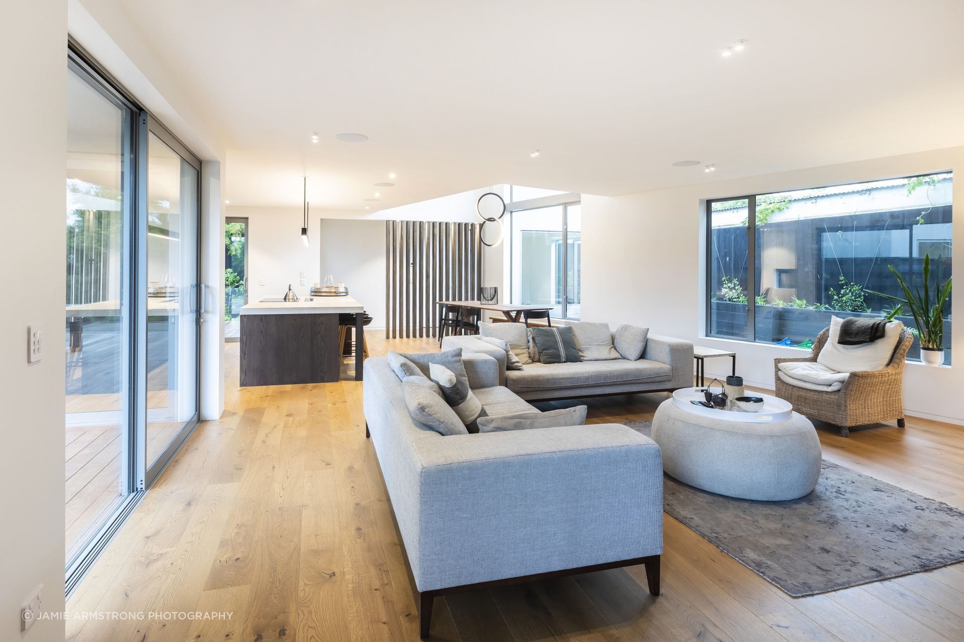The architectural design of the houses is characterised by angular shapes and intriguing voids.