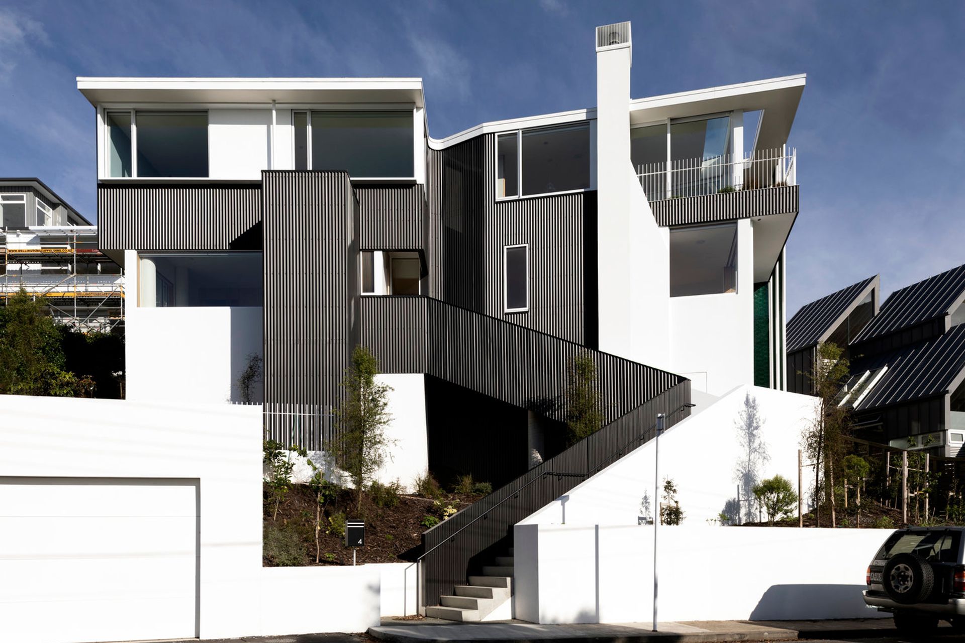 Parsonson Architects' Salmont Place project is a very modern renovation that utilises the existing concrete structure of a two-storeyed 1950s house and transforms it into two cleverly laid-out apartments overlooking Wellington harbour. Photograph by David