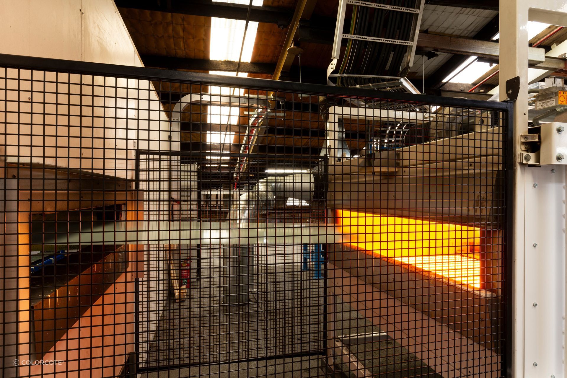 Steel being primed and cured through ColorCote’s
infrared ovens.