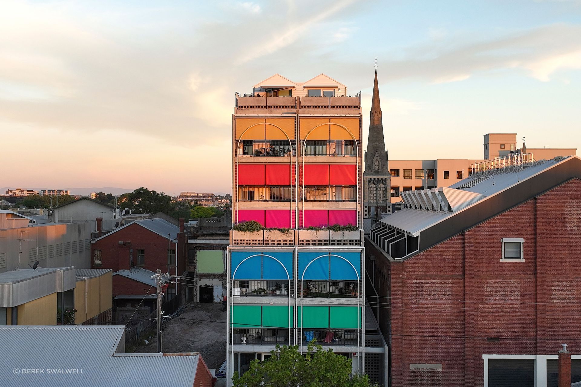 The playful colours selected for the sun shading on this multi-residential project give it personality and character.