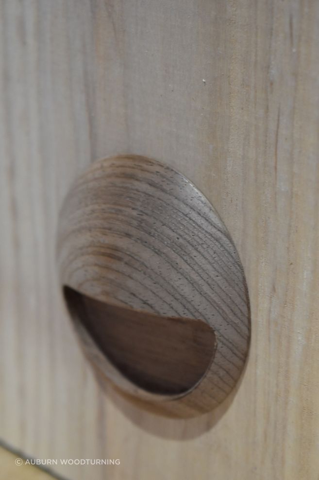 The inset pull are a recessed handle fixed within a mortised cavity that allows fingertips to pull the door outward