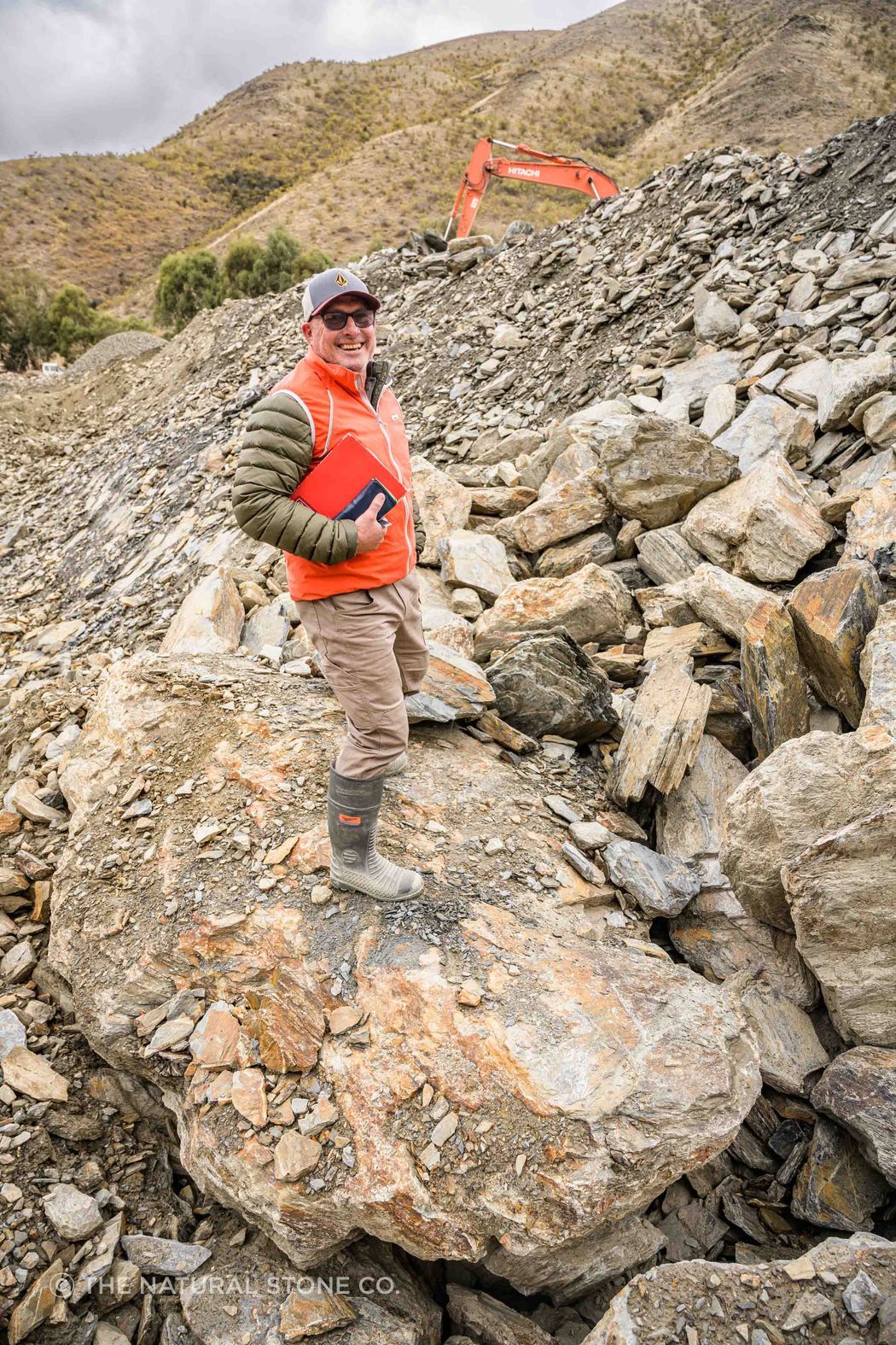 The Natural Stone Co.’s Peter Flint selecting a schist boulder.