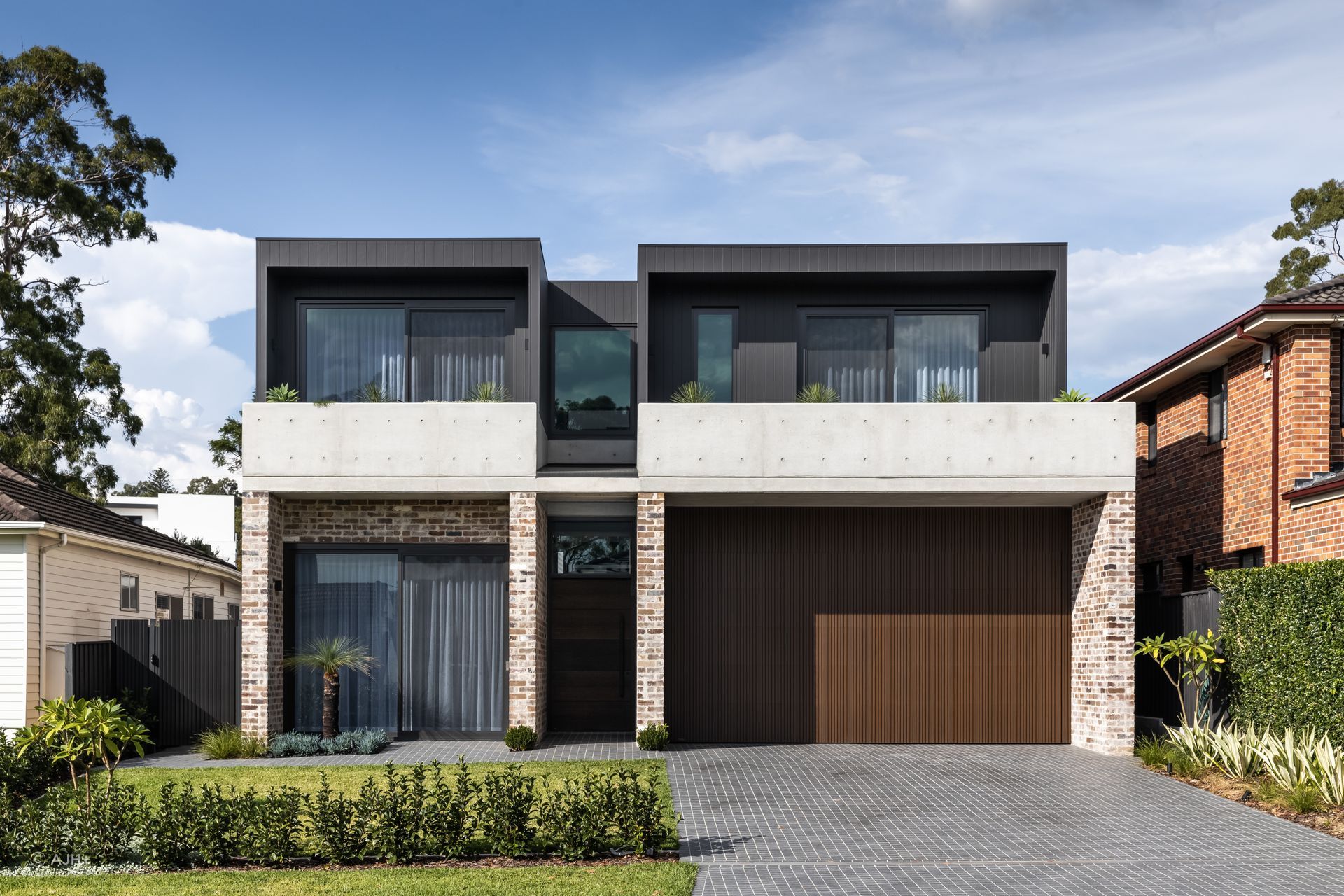 Bespoke recycled brick, off-form concrete and dark timber cladding are skillfully balanced in the exterior of Putney House - Photography: Sebastian Photography
