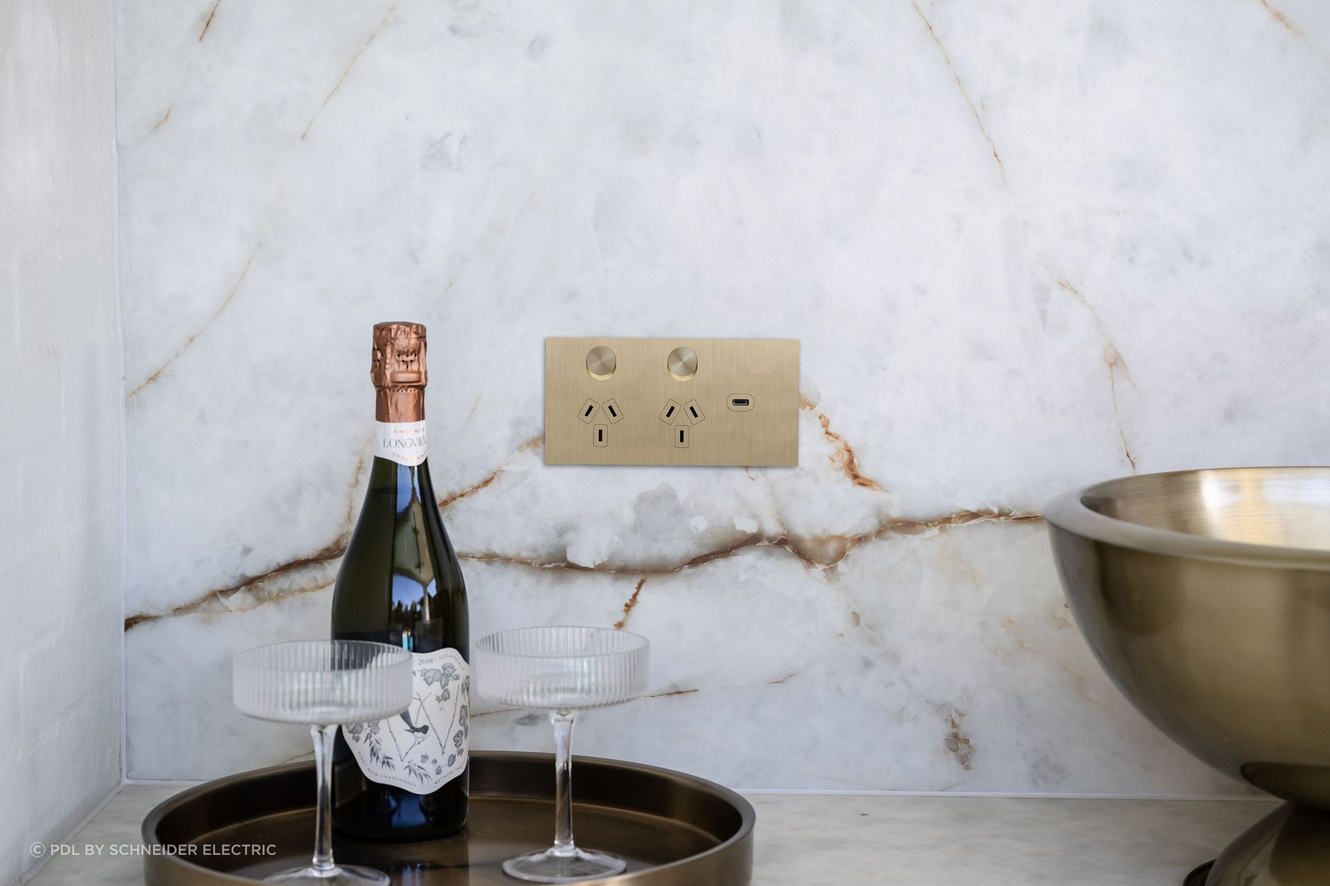 Shown here in brushed brass, the Solis T Series by Clipsal integrates modernist design and satiny texture.