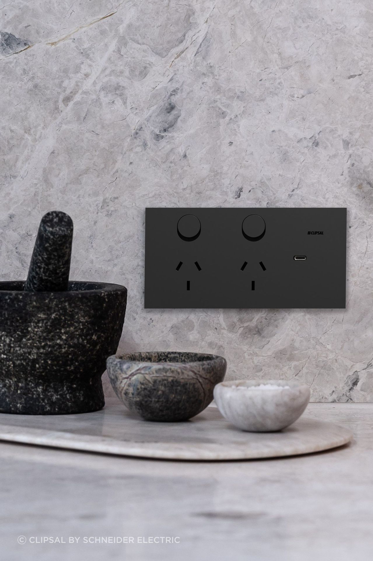 The new Clipsal Solis collection blends minimalism with smart home functionality, setting a luxurious new benchmark in electrical design. Image: Clipsal Solis Double Switch Power Point in Matte Black.