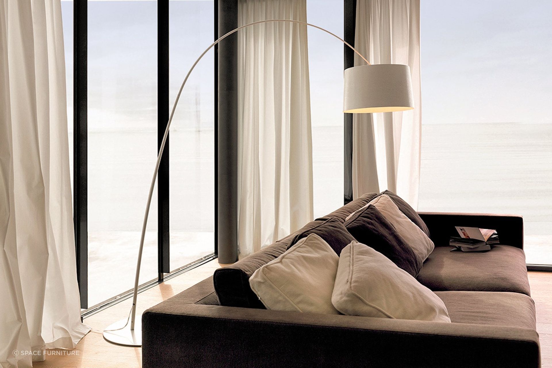 The flexible extension rod of the Twiggy Curved Floor Lamp allows for plenty of flexibility in terms of lamp placement.