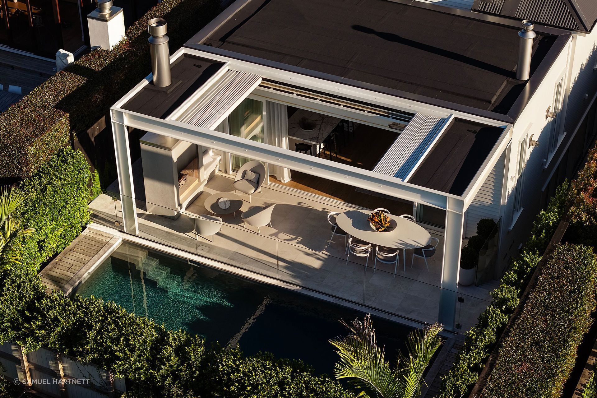 The site of teh Grey Lynn villa  was dug out to form a basement level for garaging, wine cellar, office, and media room, and a pool was added at the rear.