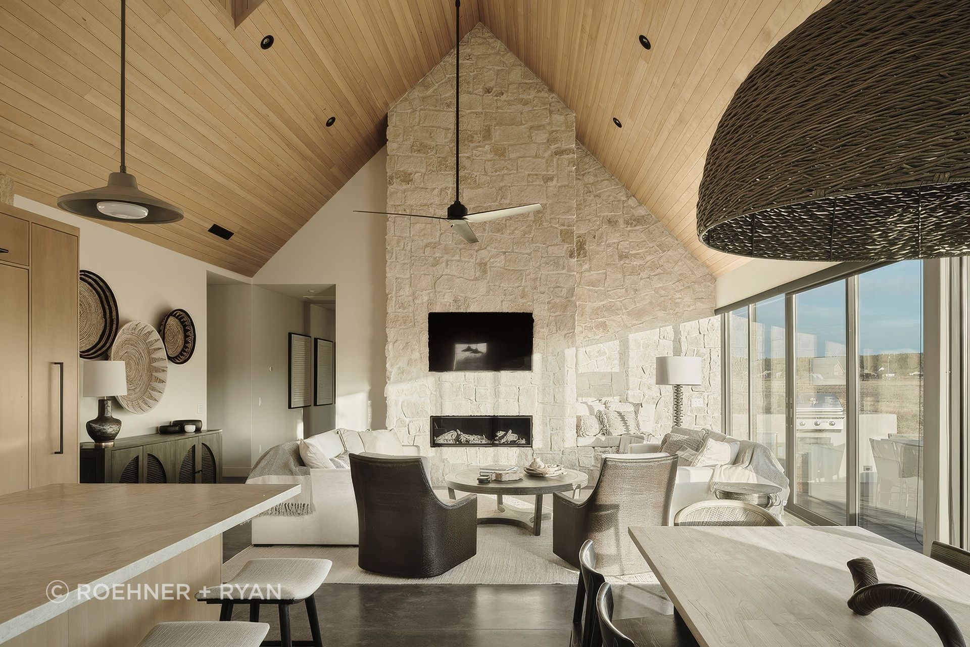 Inside Noir Peaks, The Ranch Mine pairs a soaring timber ceiling with textured stone and soft desert light, creating a space that feels both grounded and quietly expansive.