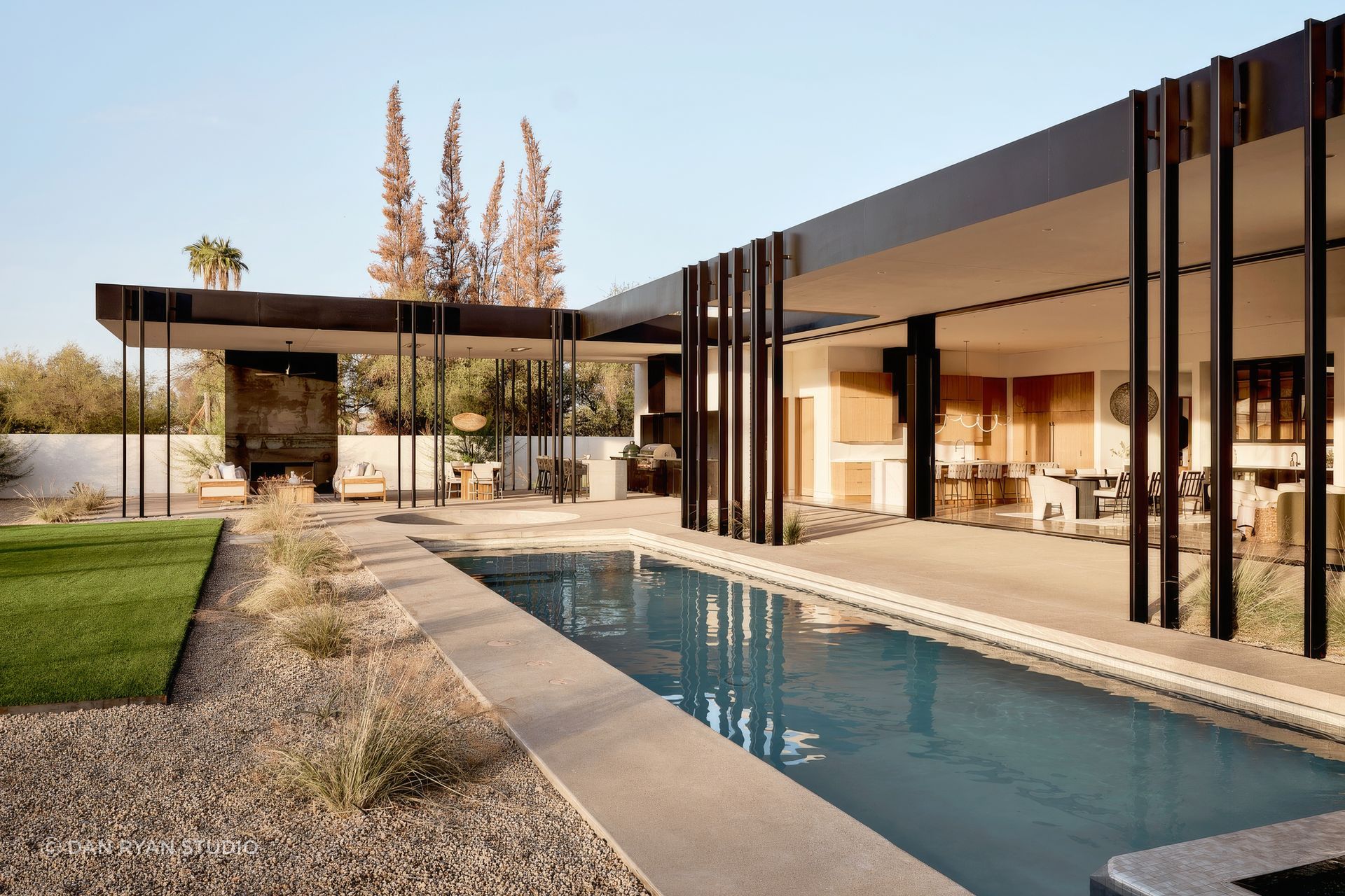 Mockingbird by The Ranch Mine shows how a carefully framed outdoor room can become the centre of daily life, with pool, kitchen, shade and landscape working together as one connected living space.