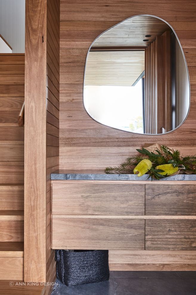 Combining textures, like the wood and stone seen here, will be key to interior design in 2024.