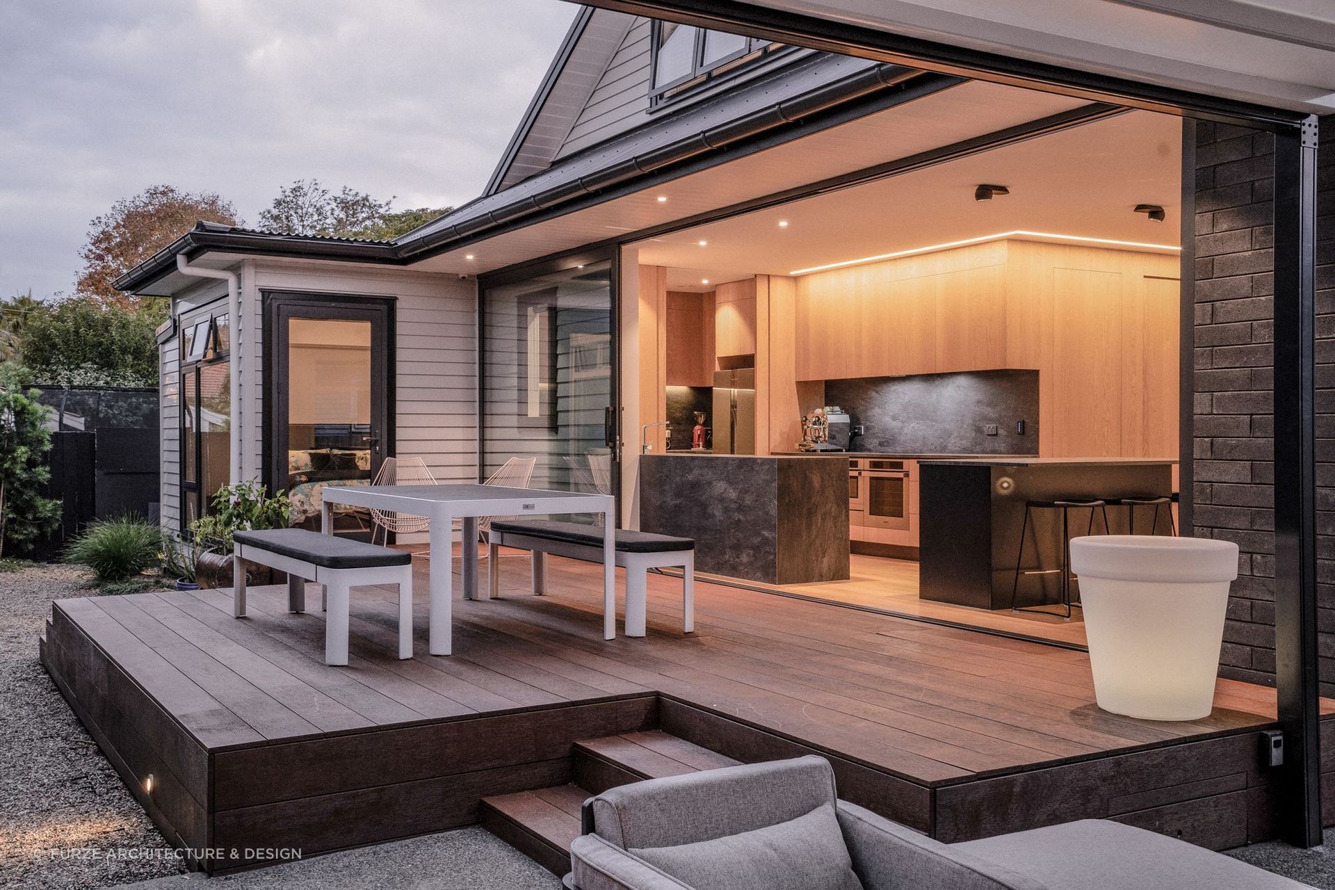 This porcelain stone splashback looks great from inside and outside the incredible Furze House.