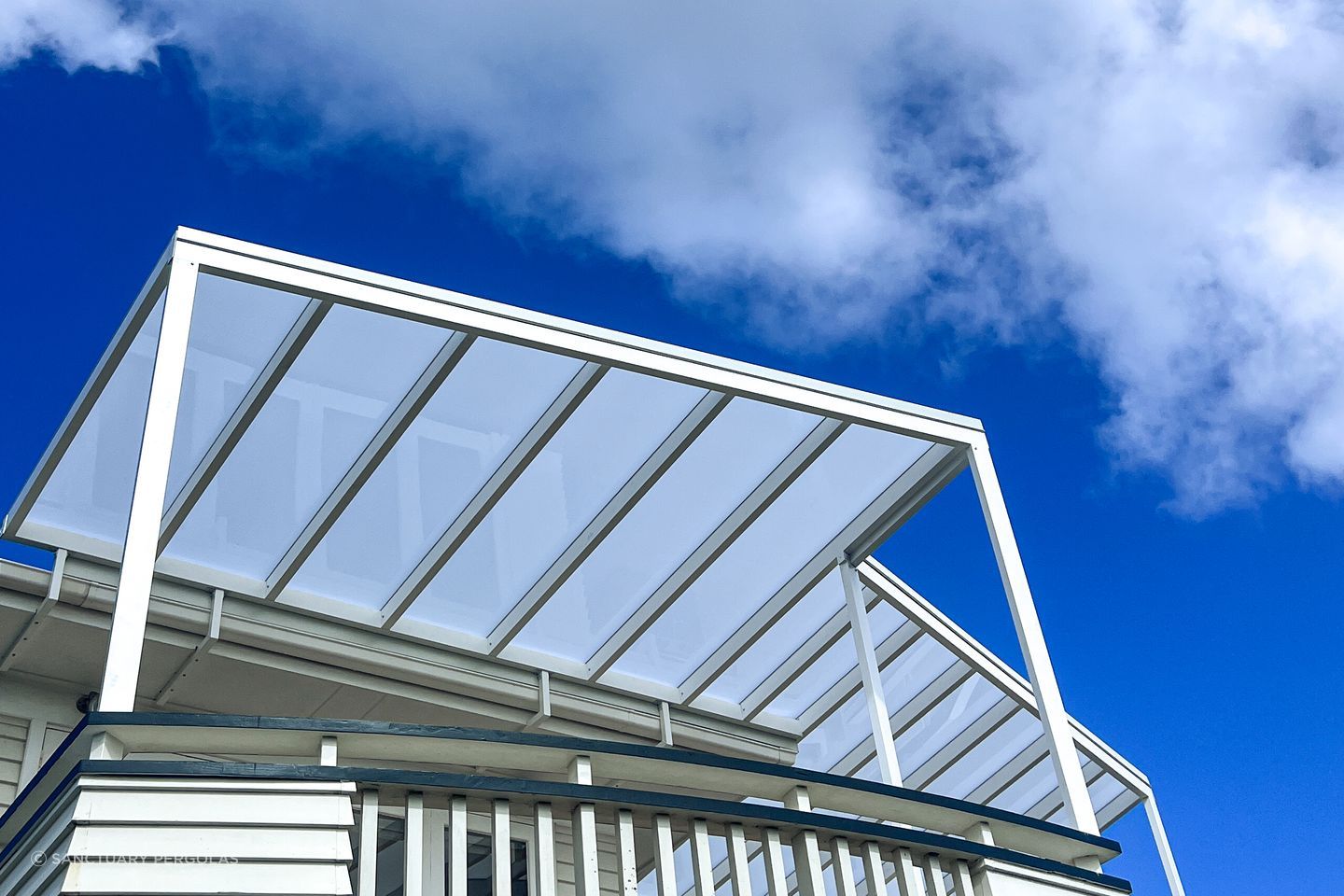 When integrating a pergola with an existing building it's crucial to customise the colour to match.