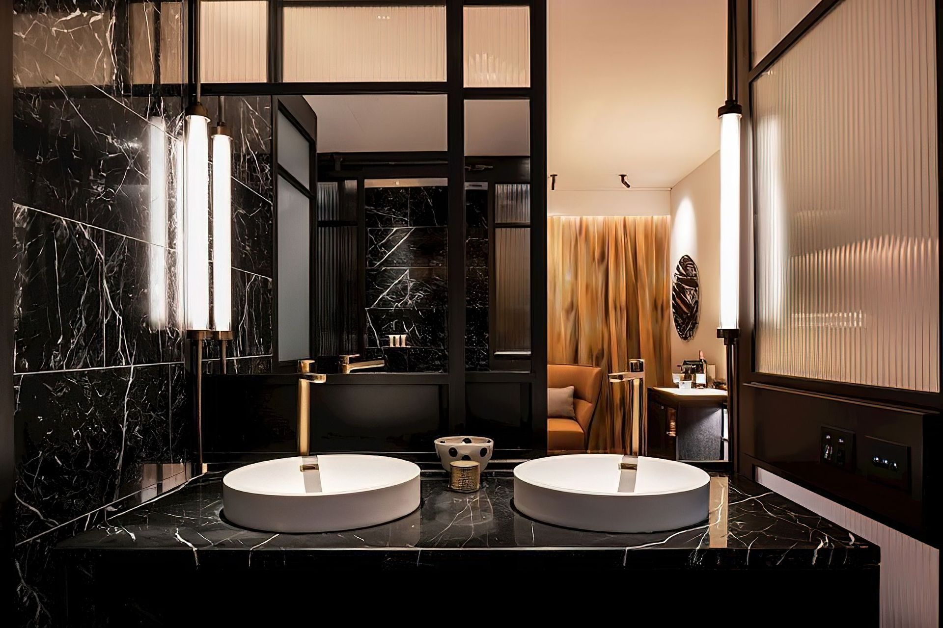 QT Hotel features elegant tube lighting in the bathroom, giving guests a well-lit space to get ready or wind down.
