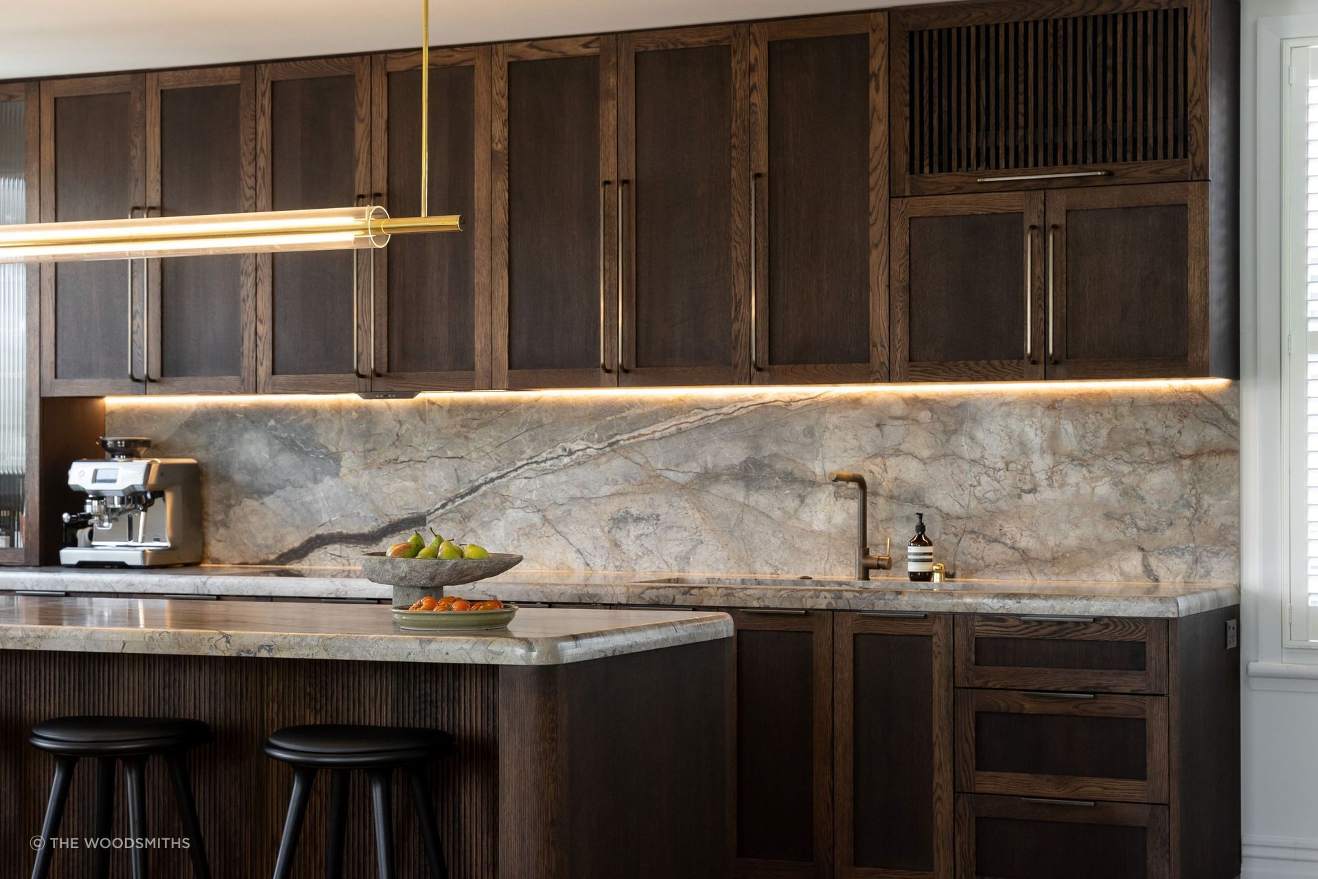 Solid wood cabinets, like these beautiful ones by The Woodsmiths, bring warmth and texture into a space.
