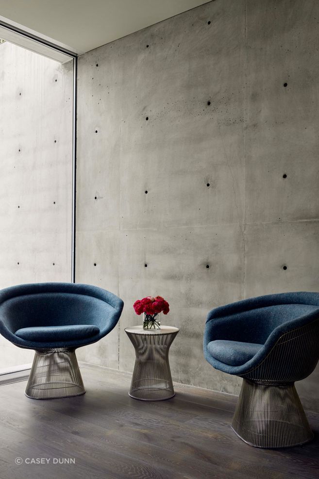 Inside the home, the form-tie holes are left visible as part of the concrete’s character, revealing the construction process rather than concealing it.