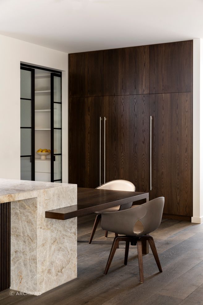 Black St uses dark timber joinery, stone and steel-framed glazing to form a deliberate material sequence, where every junction between old and new is resolved early.