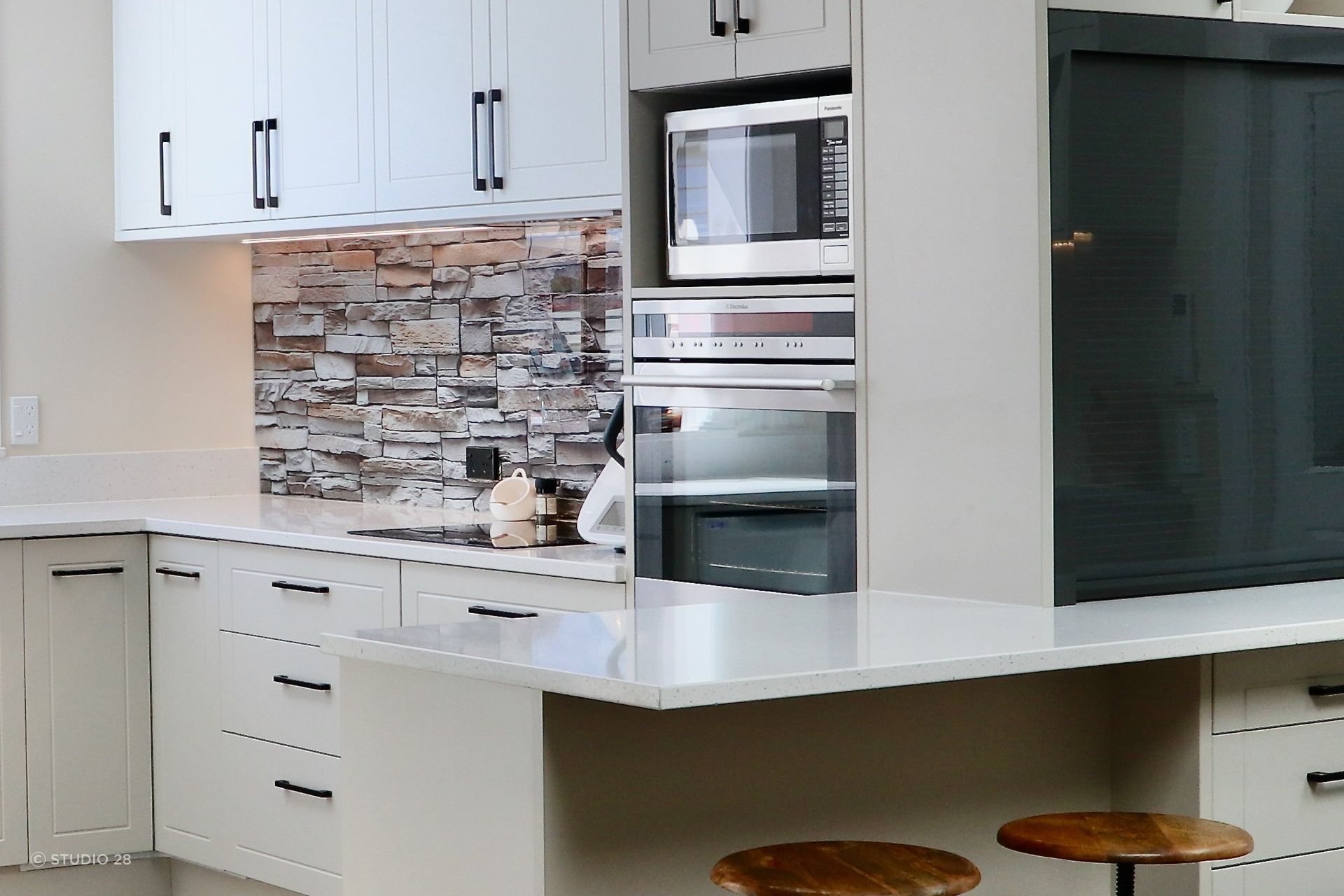A thoroughly convincing take on the brick splashback in this clever kitchen renovation.
