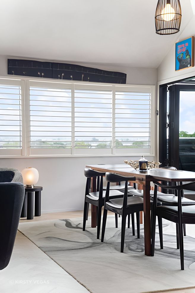 This space was elevated by the client’s original Bernard Vuarnesson dining table and Wegner chairs, paired with an Artisan “Ink Vapour” rug, Simon James “Offset” stool, “Bloom” lamp and Tom Dixon accessories—timeless pieces that endure.