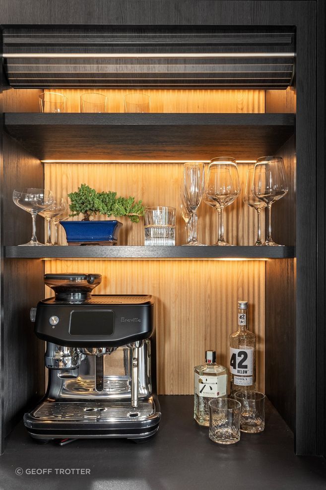 “The clients are steel fabricators, so aesthetically they wanted old-meets-new, dark, pops of oak, and a nod to steel that complemented the Rimu joinery.”
