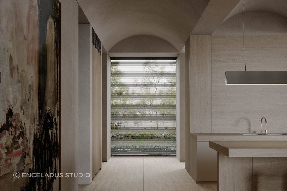 A barrel-vaulted ceiling and pale oak palette bring warmth and visual clarity to the interior, framing the transition between rooms and garden.