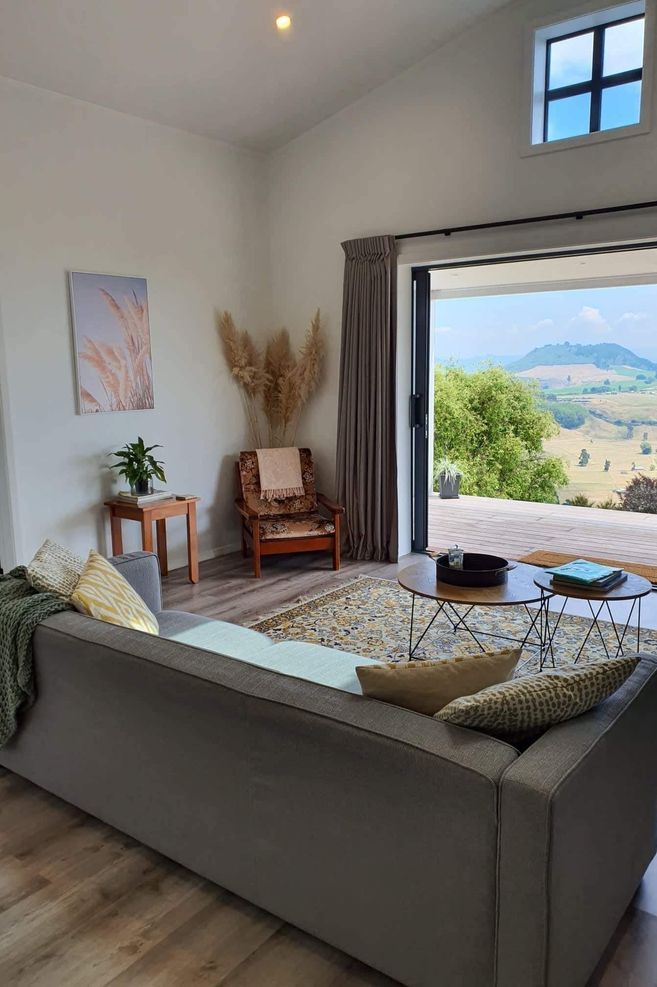 The open-plan living area features a pitched ceiling to make the space feel larger.