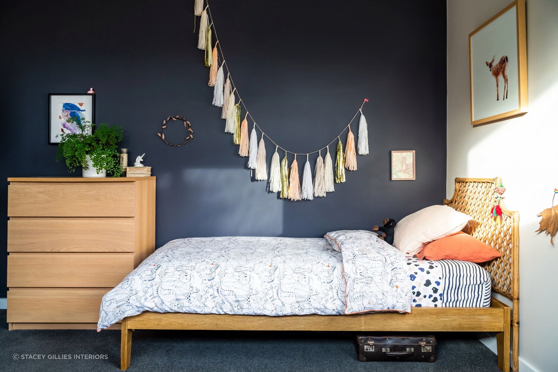 Just a little bit of greenery brings freshness to this beautifully designed children's room by Stacey Gillies Interiors.