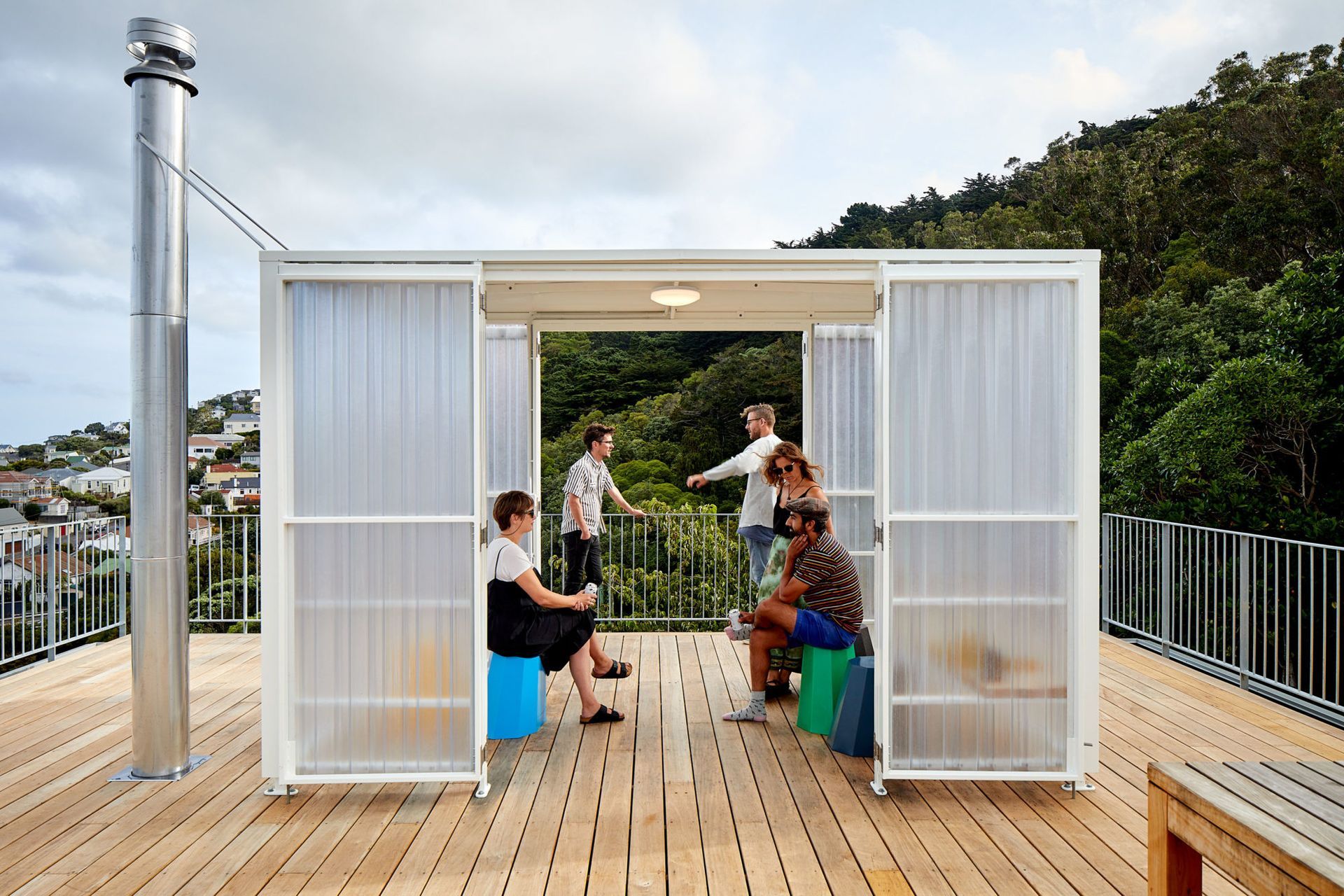 The 10x10 house makes the most of its steep site with a rooftop entertainment area that captures the view.