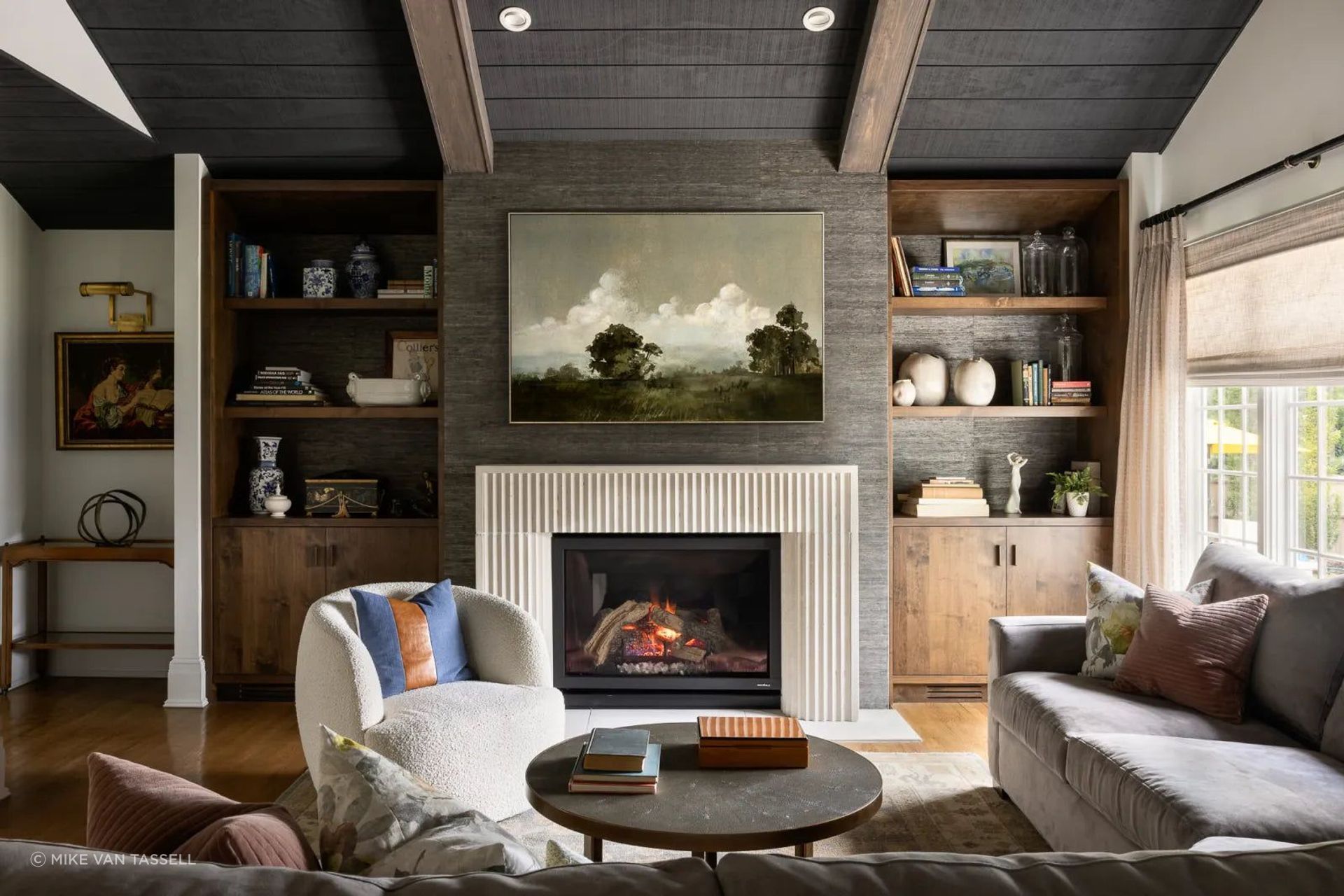 The darker, more modern design in the family room was an intentional choice for this later addition to the original home.