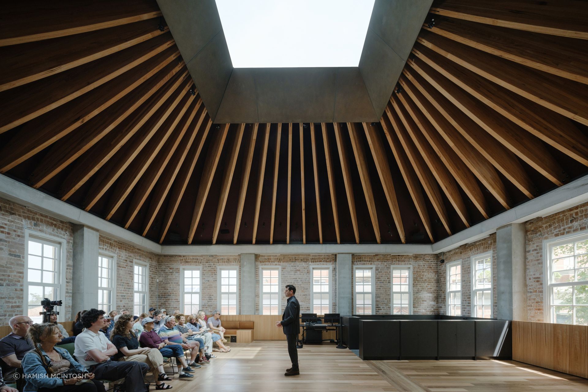 Stunning tapered ceiling beams made from MASSLAM and fabricated by TGA Engineers, leading to a vast skylight at the restored Boot Factory building in Bondi Junction. Image Hamish McIntosh