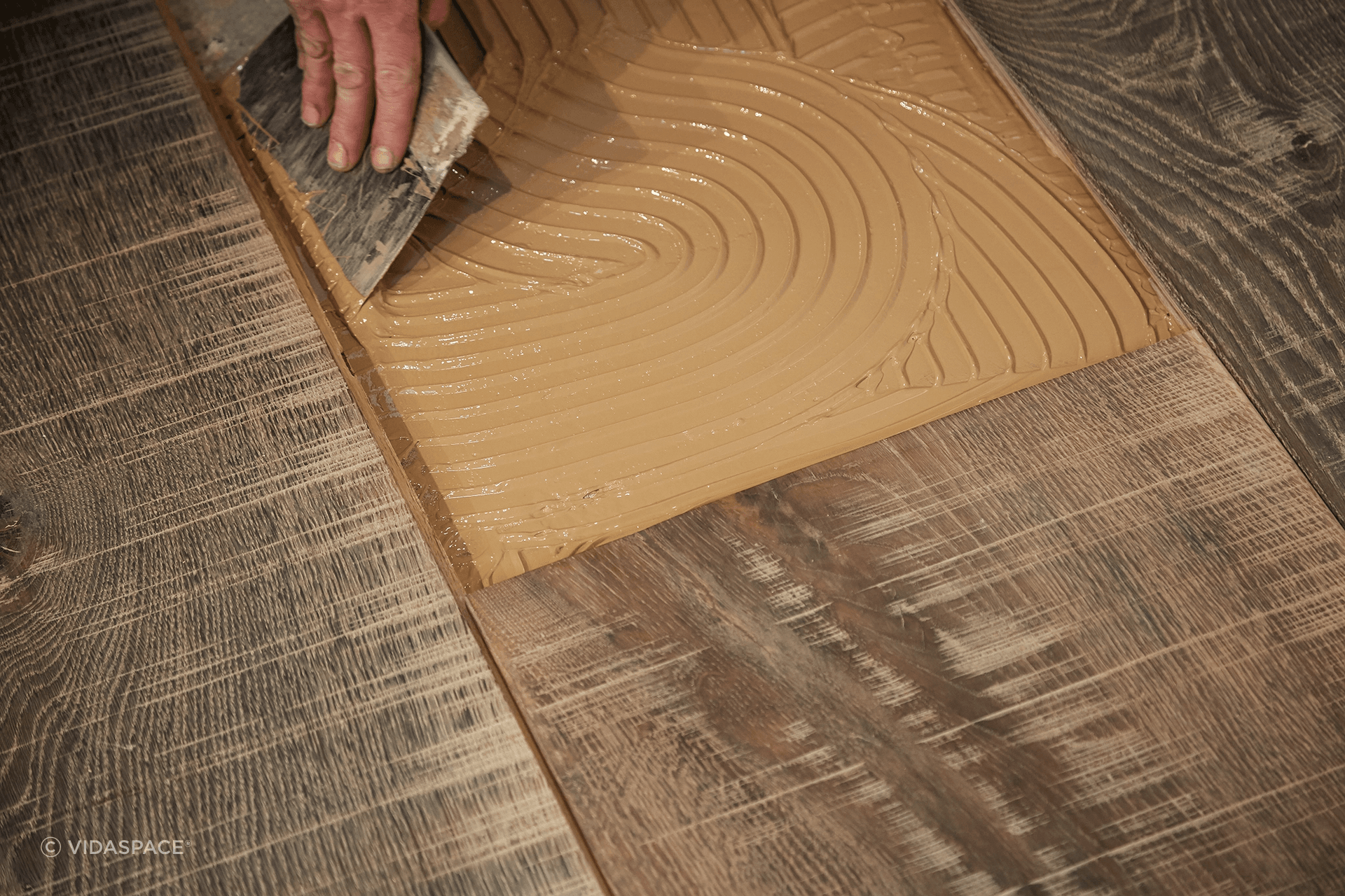 66709fa53d77a5b20da626daGluing-engineeered-timber-floor-down.png