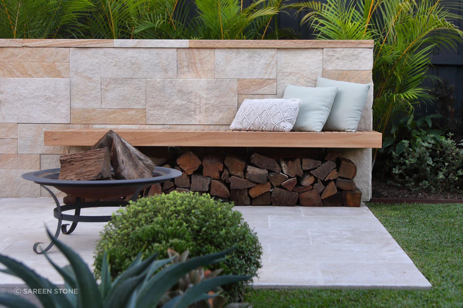 Lavarosa Anticato pavers set the scene in this garden retreat, a natural base for outdoor living around the fire pit.