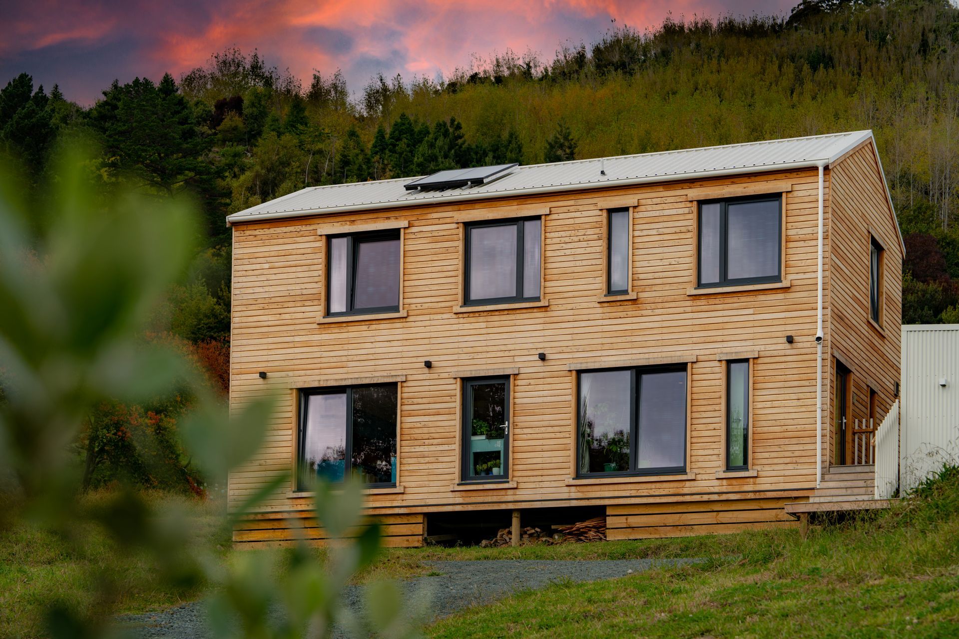 The home is clad in macrocarpa weatherboards harvested and milled only 45 minutes down the road.