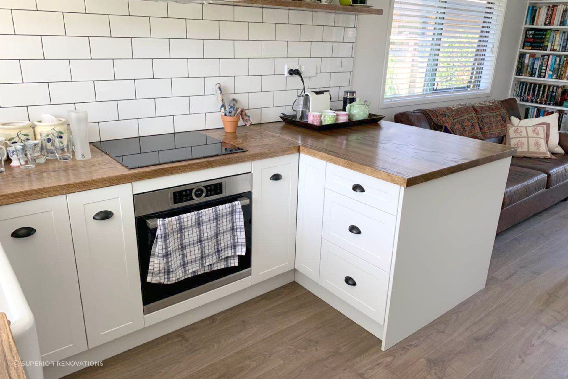 Kitchen renovation in Mangere Bridge:  American Ashwood was used as the benchtop to add texture and a natural element to the kitchen.