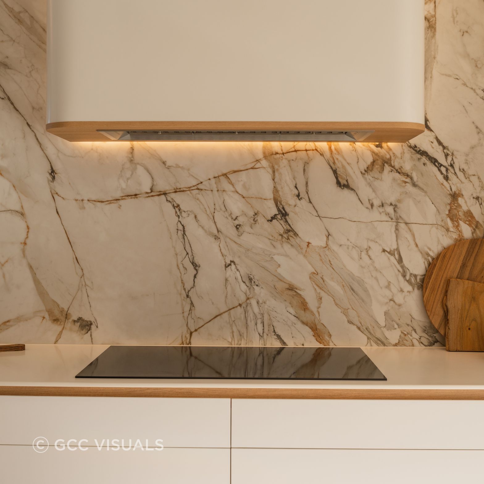 The Avenue.  Dramatic Neolith stone is a feautre of this coastal inspired kitchen.  Signature CBGH curved rangehood joinery detail.