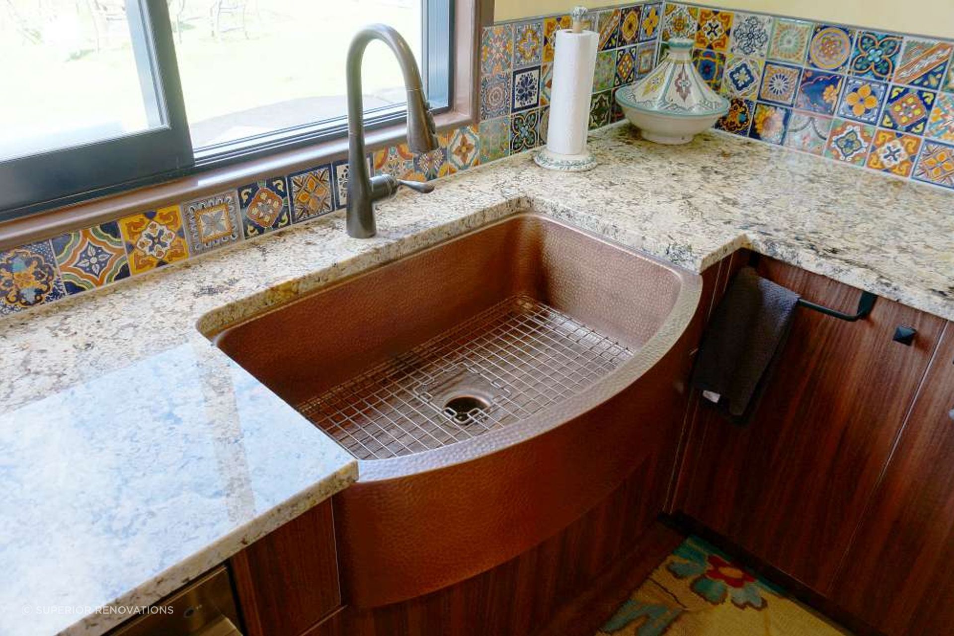 Kitchen renovation in Stanmore Bay: Textured Brass sink and tap fixtures added metal elements to this kitchen in Orewa.