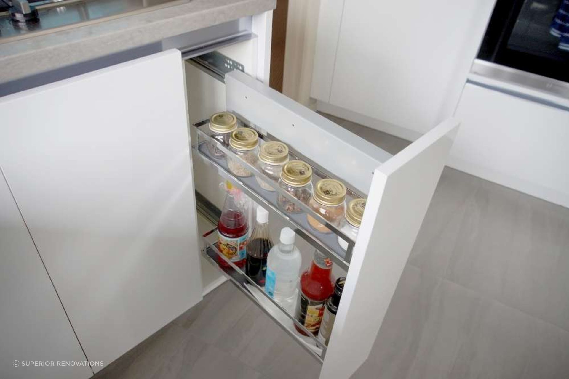 
 Custom built storage solution for cabinets to store condiments.