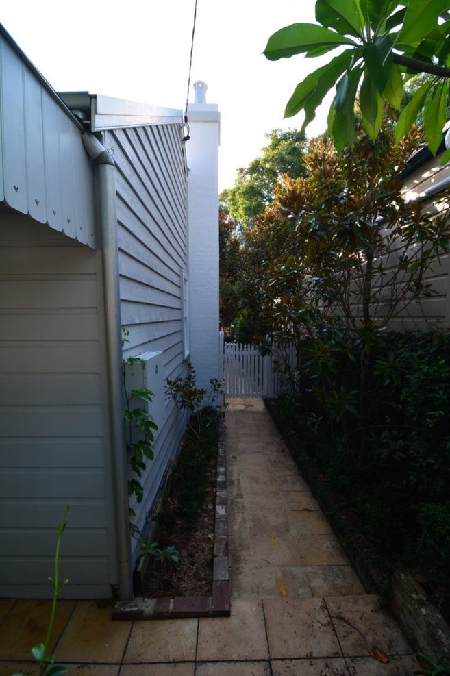 Re-using the original weatherboards after insulating the front section of the house greatly reduced the footprint of the total renovation.