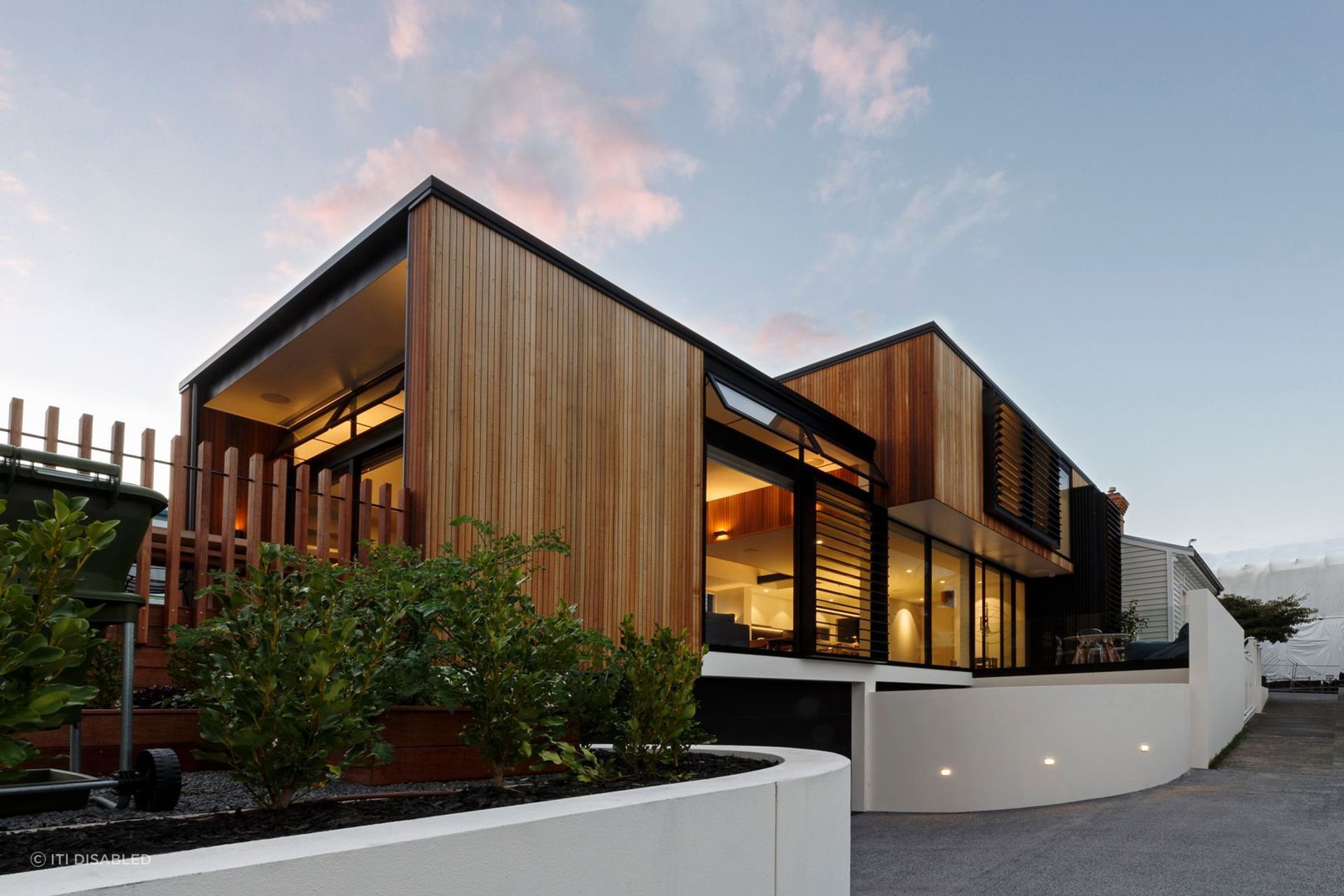 This modern home features textured wall panels along with the beautiful Kwila Handrails.