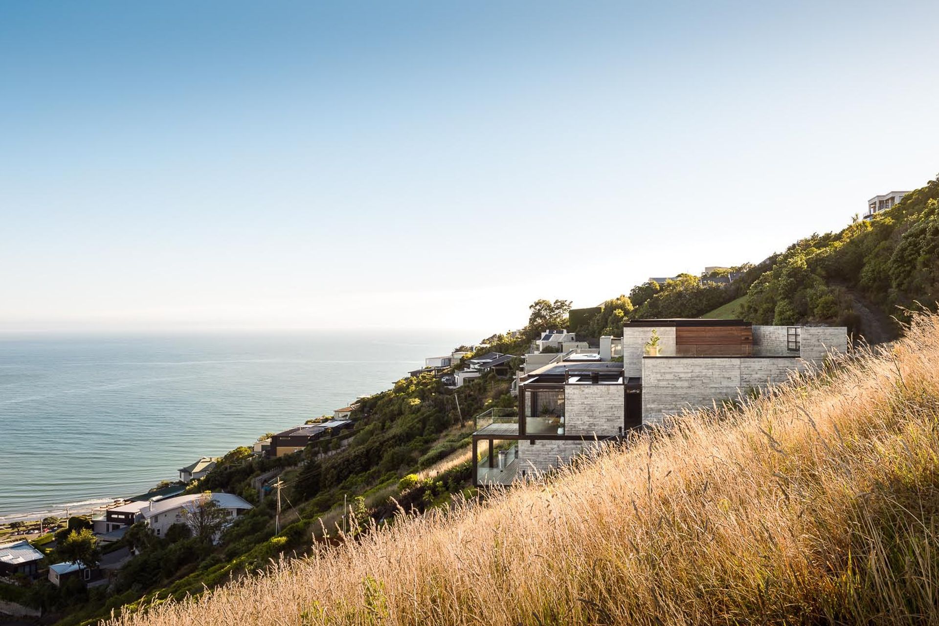 The structure emerges from the landscape in cubed forms.