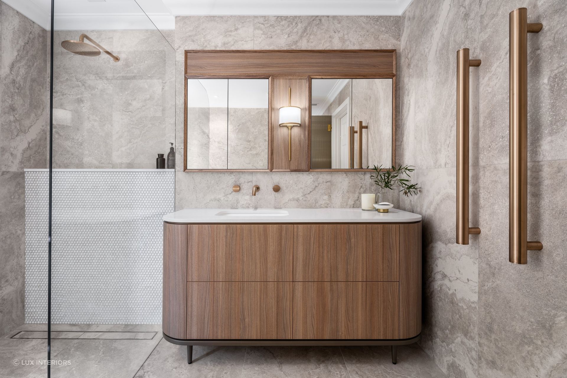 Mirrored cabinets offer functional storage space. Featured project: Lovegrove Project