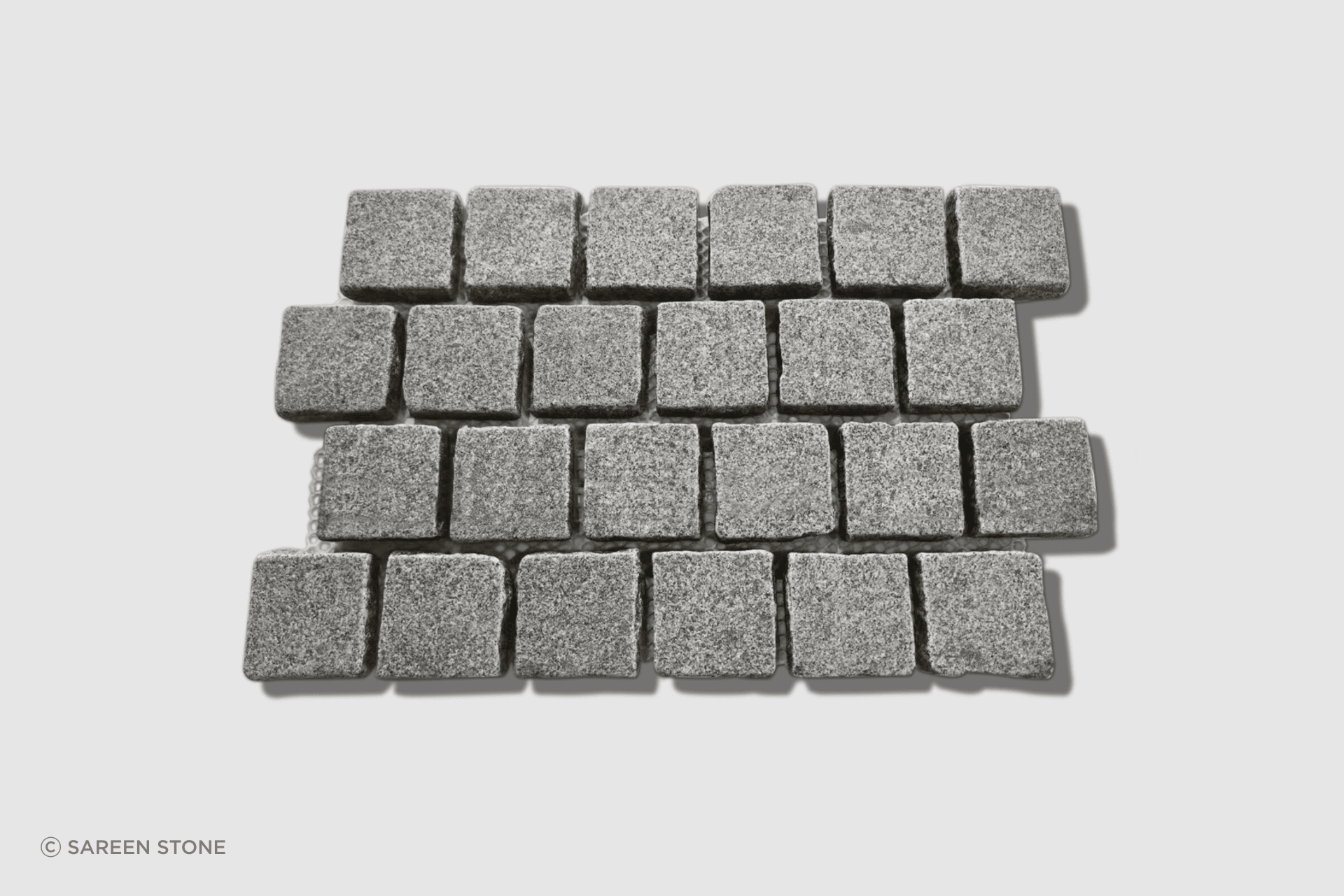 Silhouette Granite Tumbled Cobblestones launched in 2025. Dense mid-grey granite with P5 slip resistance, mounted on mesh sheets in brick bond pattern. The 90×90×30mm format is ideal for driveways, pathways, courtyards, and high-traffic outdoor areas.