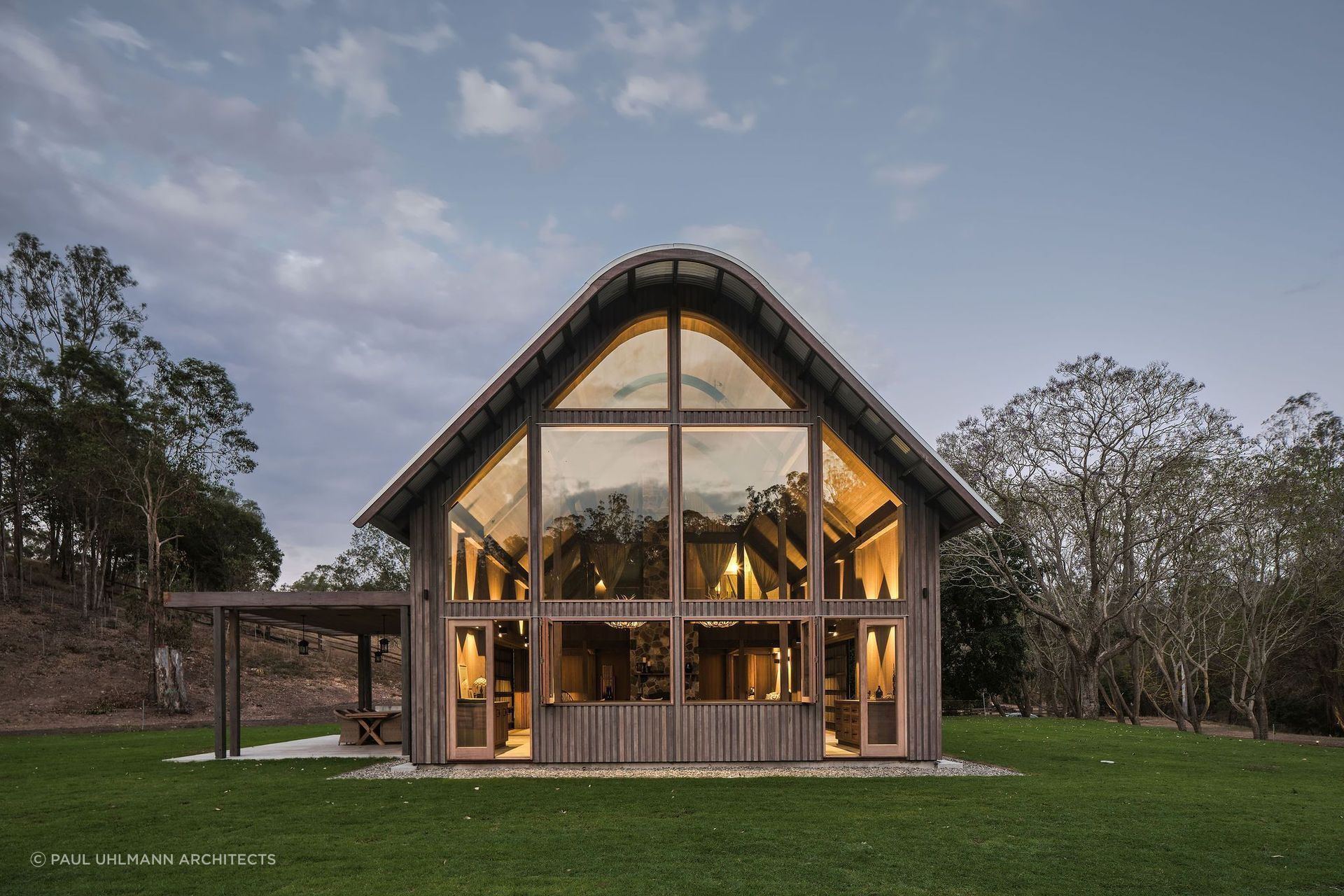 Barn style homes often have gambrel roofs, mimicking a traditional barn. Photographer: Amy Macpherson Studio.