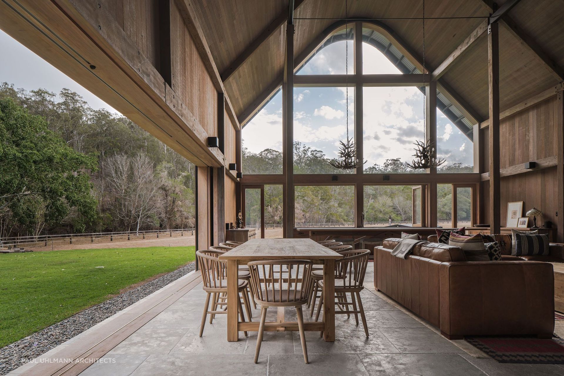 Open interiors are a feature of many barn homes. Photographer: Amy Macpherson Studio.