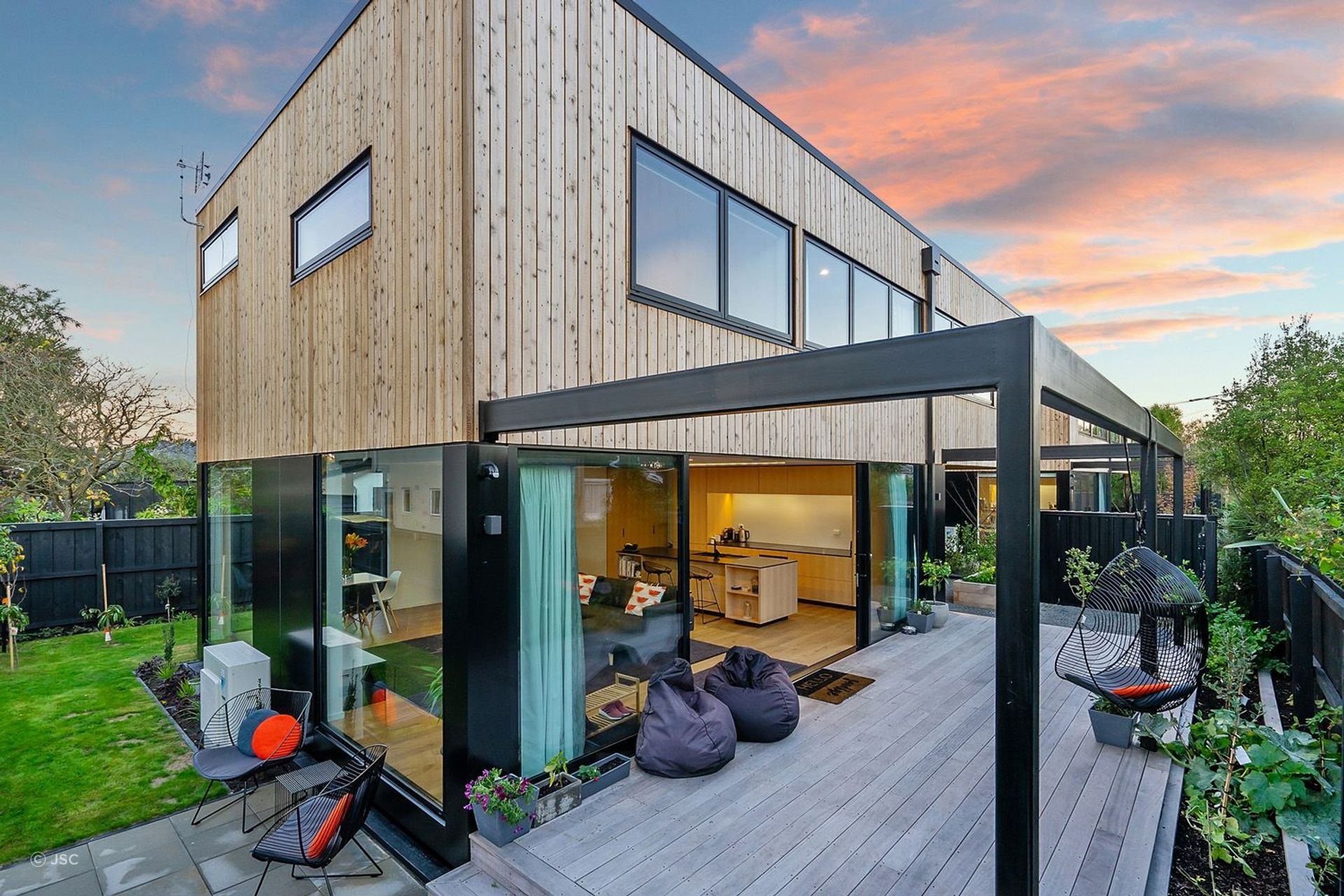 A great example of vertically aligned wood cladding using JSC Rustic Cedar.
