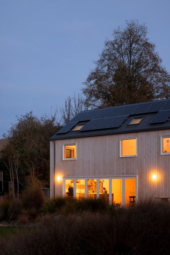 Solar panels line the roof, providing renewable energy to the family home.