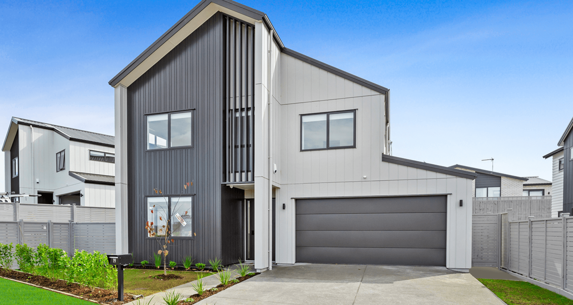 Flatline Smooth sectional door with Negative detail in Colorsteel Windsor Grey