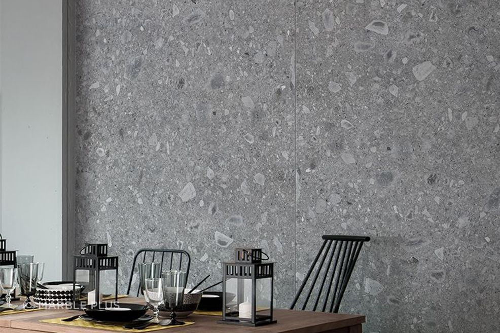 A grey porcelain tile wall with unique patterns.