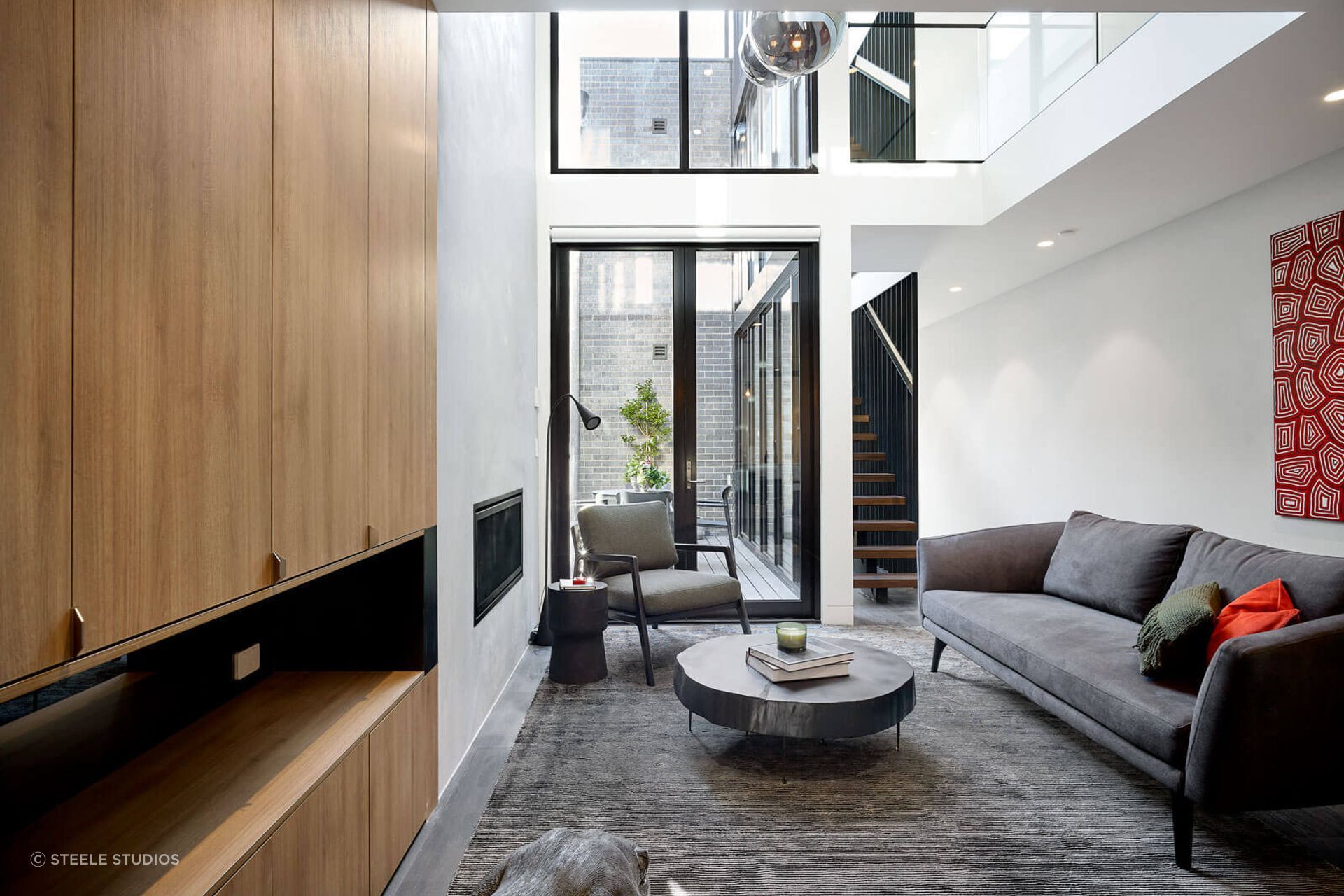 Distressed materials, textures and textiles instil the industrial theme in this Cremorne home