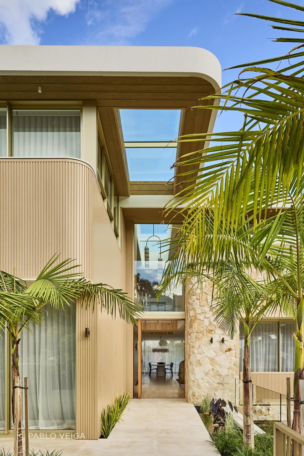 Wanderlust in Vaucluse by Conway & Wise. A coastal sanctuary inspired by Morocco, Santorini, and Los Angeles, featuring Crema Vialle Limestone flowing through the entry, balconies, and outdoor spaces. One of 2025's standout residential projects.