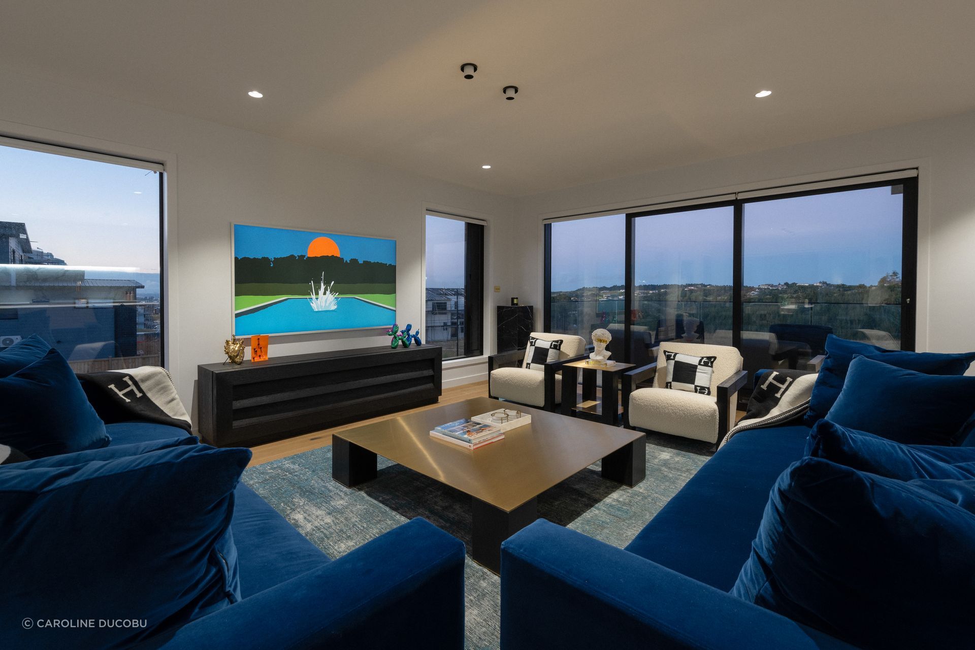 There are plenty of spaces to gather in the home, including the main lounge area.